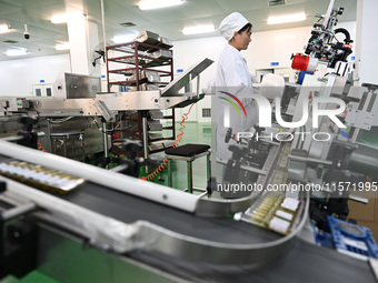 A worker produces diclofenac sodium injection at a pharmaceutical company in Suqian, China, on September 13, 2024. (