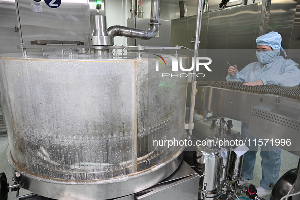 A worker produces diclofenac sodium injection at a pharmaceutical company in Suqian, China, on September 13, 2024. 