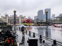 Citizens travel in the rain in Chengdu, China, on September 14, 2024. (