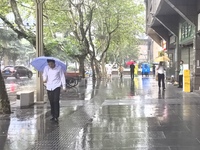 Citizens travel in the rain in Chengdu, China, on September 14, 2024. (