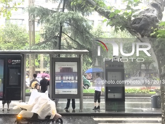 Citizens travel in the rain in Chengdu, China, on September 14, 2024. (