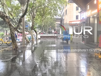 Citizens travel in the rain in Chengdu, China, on September 14, 2024. (