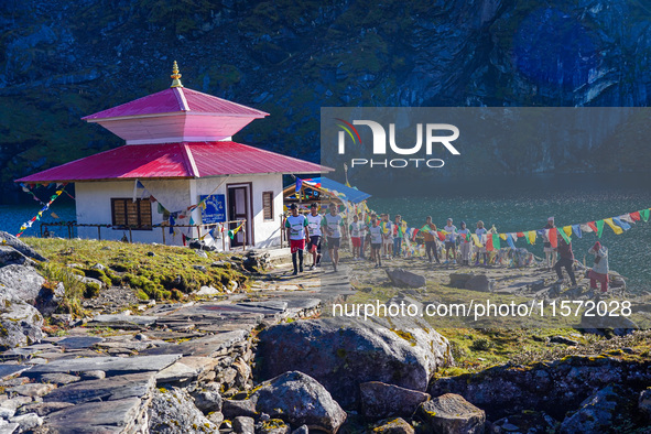 Runners participate in the first Timbung Pokhari Trail Run competition in Taplejung, Nepal, on September 11, 2024. 