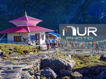 Runners participate in the first Timbung Pokhari Trail Run competition in Taplejung, Nepal, on September 11, 2024. (