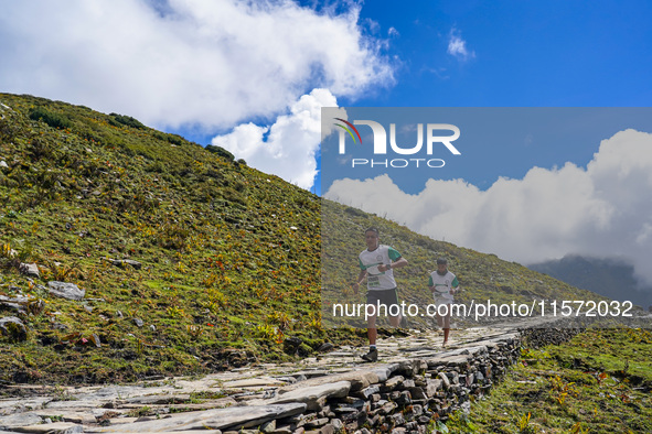 Runners participate in the first Timbung Pokhari Trail Run competition in Taplejung, Nepal, on September 11, 2024. 