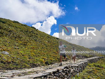 Runners participate in the first Timbung Pokhari Trail Run competition in Taplejung, Nepal, on September 11, 2024. (