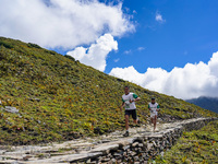 Runners participate in the first Timbung Pokhari Trail Run competition in Taplejung, Nepal, on September 11, 2024. (