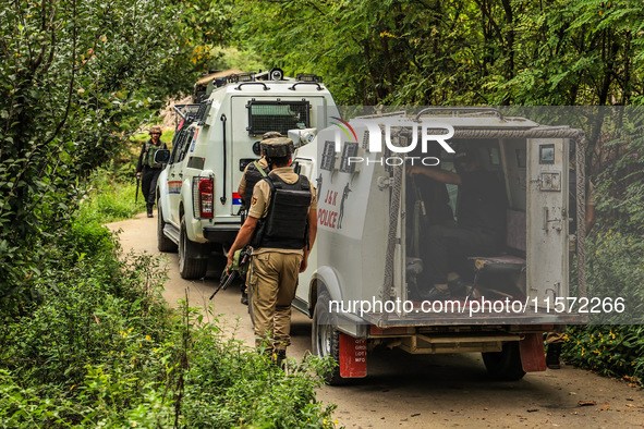 Security forces near the encounter site in which three militants are killed in Kreeri Tapper Pattan Baramulla, Jammu and Kashmir, India, on...