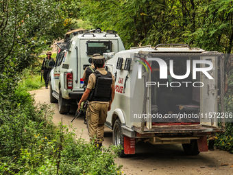 Security forces near the encounter site in which three militants are killed in Kreeri Tapper Pattan Baramulla, Jammu and Kashmir, India, on...