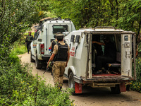 Security forces near the encounter site in which three militants are killed in Kreeri Tapper Pattan Baramulla, Jammu and Kashmir, India, on...