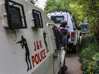 Security forces near the encounter site in which three militants are killed in Kreeri Tapper Pattan Baramulla, Jammu and Kashmir, India, on...