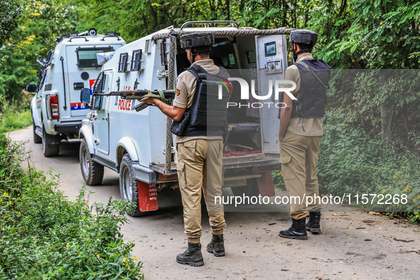 Security forces near the encounter site in which three militants are killed in Kreeri Tapper Pattan Baramulla, Jammu and Kashmir, India, on...