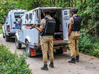 Security forces near the encounter site in which three militants are killed in Kreeri Tapper Pattan Baramulla, Jammu and Kashmir, India, on...