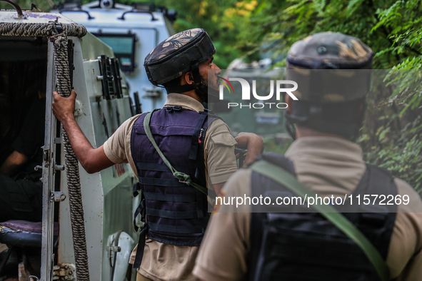 Security forces near the encounter site in which three militants are killed in Kreeri Tapper Pattan Baramulla, Jammu and Kashmir, India, on...