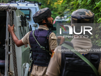 Security forces near the encounter site in which three militants are killed in Kreeri Tapper Pattan Baramulla, Jammu and Kashmir, India, on...