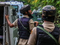 Security forces near the encounter site in which three militants are killed in Kreeri Tapper Pattan Baramulla, Jammu and Kashmir, India, on...