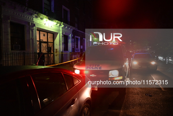 Police guard the scene. Police shoot and kill a man who flashes a knife at them at an apartment in Flatbush, Brooklyn, New York, United Stat...