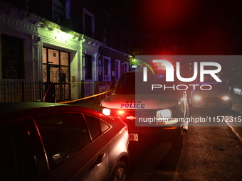 Police guard the scene. Police shoot and kill a man who flashes a knife at them at an apartment in Flatbush, Brooklyn, New York, United Stat...