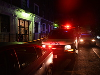 Police guard the scene. Police shoot and kill a man who flashes a knife at them at an apartment in Flatbush, Brooklyn, New York, United Stat...