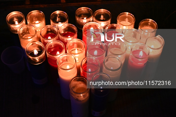 A makeshift memorial with candles stands at the scene. Police shoot and kill a man who flashes a knife at them at an apartment in Flatbush,...