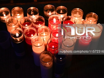 A makeshift memorial with candles stands at the scene. Police shoot and kill a man who flashes a knife at them at an apartment in Flatbush,...