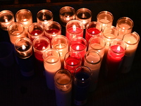 A makeshift memorial with candles stands at the scene. Police shoot and kill a man who flashes a knife at them at an apartment in Flatbush,...