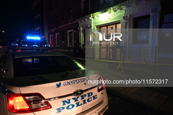 Police guard the scene. Police shoot and kill a man who flashes a knife at them at an apartment in Flatbush, Brooklyn, New York, United Stat...