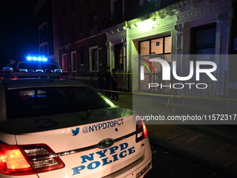 Police guard the scene. Police shoot and kill a man who flashes a knife at them at an apartment in Flatbush, Brooklyn, New York, United Stat...