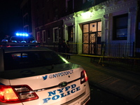 Police guard the scene. Police shoot and kill a man who flashes a knife at them at an apartment in Flatbush, Brooklyn, New York, United Stat...