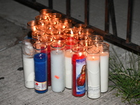 A makeshift memorial stands at the scene of candles. Police shoot and kill a man who flashes a knife at them at an apartment in Flatbush, Br...