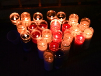 Makeshift memorial candles are at the scene. Police shoot and kill a man who flashes a knife at them at an apartment in Flatbush, Brooklyn,...