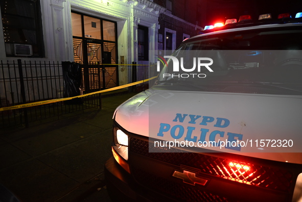 Police guard the scene. Police shoot and kill a man who flashes a knife at them at an apartment in Flatbush, Brooklyn, New York, United Stat...