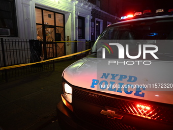 Police guard the scene. Police shoot and kill a man who flashes a knife at them at an apartment in Flatbush, Brooklyn, New York, United Stat...