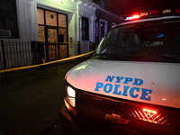 Police guard the scene. Police shoot and kill a man who flashes a knife at them at an apartment in Flatbush, Brooklyn, New York, United Stat...