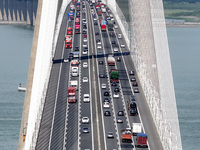 Vehicles travel on the Shanghai-Suzhou-Nantong Yangtze River Bridge in Suzhou, China, on September 14, 2024. (