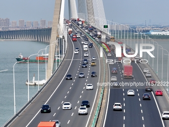 Vehicles travel on the Shanghai-Suzhou-Nantong Yangtze River Bridge in Suzhou, China, on September 14, 2024. (