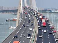 Vehicles travel on the Shanghai-Suzhou-Nantong Yangtze River Bridge in Suzhou, China, on September 14, 2024. (