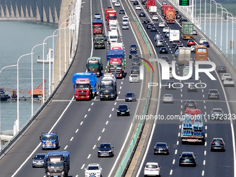 Vehicles travel on the Shanghai-Suzhou-Nantong Yangtze River Bridge in Suzhou, China, on September 14, 2024. (