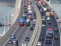 Vehicles travel on the Shanghai-Suzhou-Nantong Yangtze River Bridge in Suzhou, China, on September 14, 2024. (