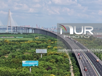 Vehicles travel on the Shanghai-Suzhou-Nantong Yangtze River Bridge in Suzhou, China, on September 14, 2024. (