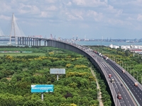 Vehicles travel on the Shanghai-Suzhou-Nantong Yangtze River Bridge in Suzhou, China, on September 14, 2024. (