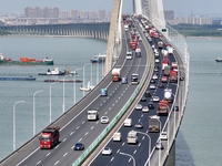 Vehicles travel on the Shanghai-Suzhou-Nantong Yangtze River Bridge in Suzhou, China, on September 14, 2024. (