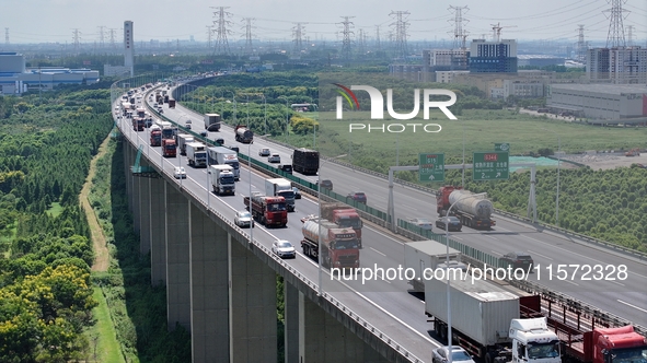 Vehicles travel on the Shanghai-Suzhou-Nantong Yangtze River Bridge in Suzhou, China, on September 14, 2024. 