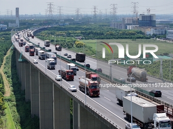 Vehicles travel on the Shanghai-Suzhou-Nantong Yangtze River Bridge in Suzhou, China, on September 14, 2024. (