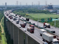 Vehicles travel on the Shanghai-Suzhou-Nantong Yangtze River Bridge in Suzhou, China, on September 14, 2024. (