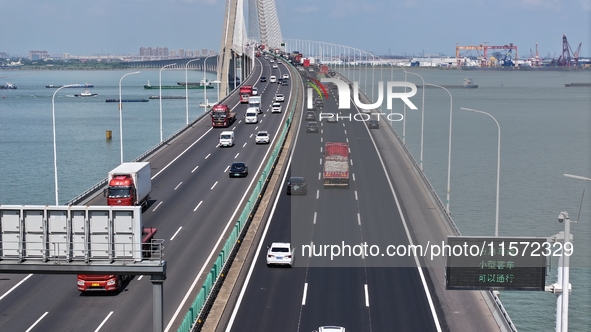 Vehicles travel on the Shanghai-Suzhou-Nantong Yangtze River Bridge in Suzhou, China, on September 14, 2024. 