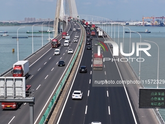 Vehicles travel on the Shanghai-Suzhou-Nantong Yangtze River Bridge in Suzhou, China, on September 14, 2024. (