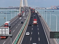 Vehicles travel on the Shanghai-Suzhou-Nantong Yangtze River Bridge in Suzhou, China, on September 14, 2024. (