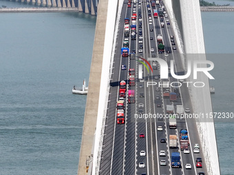 Vehicles travel on the Shanghai-Suzhou-Nantong Yangtze River Bridge in Suzhou, China, on September 14, 2024. (