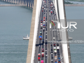 Vehicles travel on the Shanghai-Suzhou-Nantong Yangtze River Bridge in Suzhou, China, on September 14, 2024. (